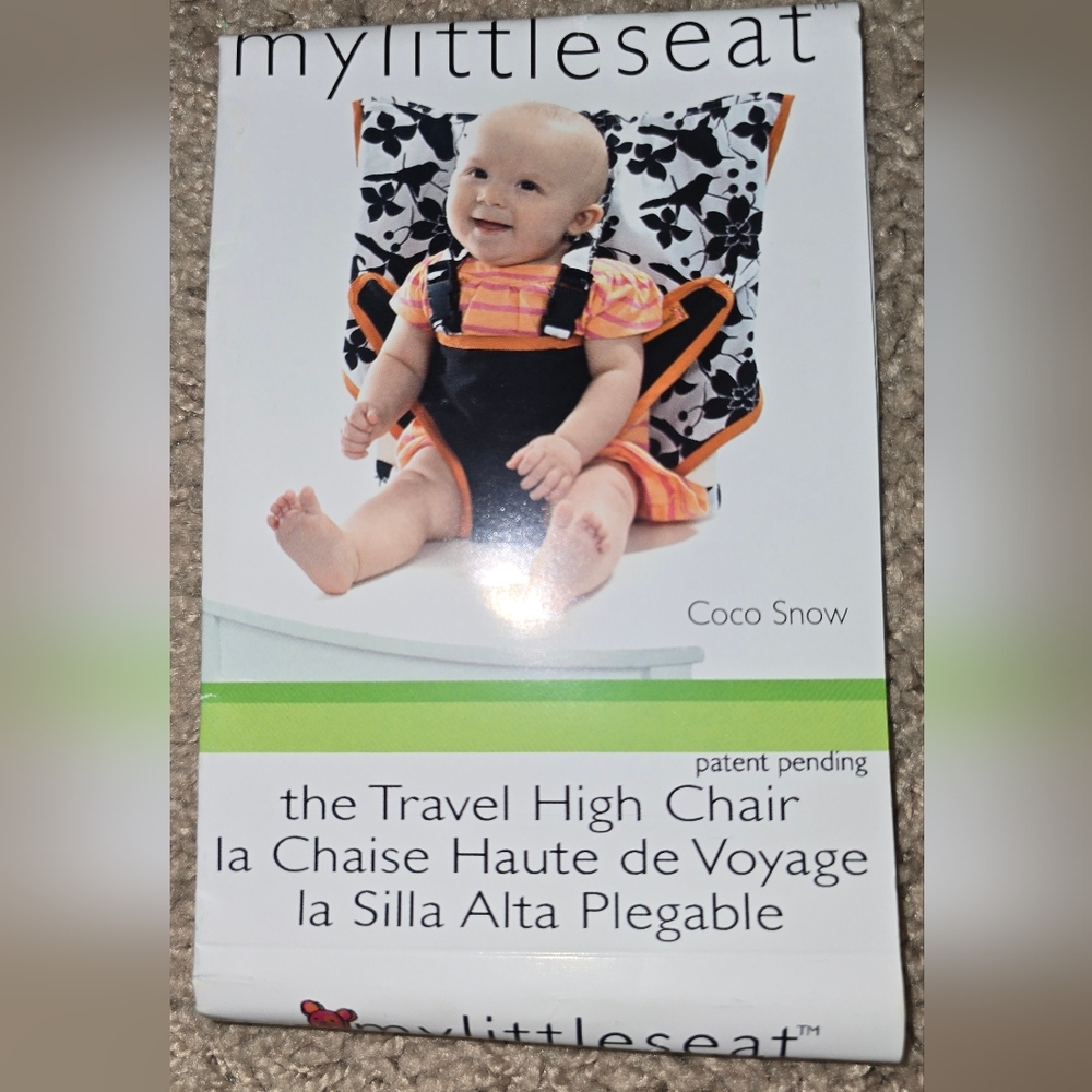 Compact Black and Orange Travel Seat with Adjustable Straps